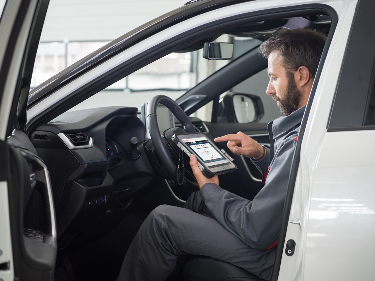 Technician checking car